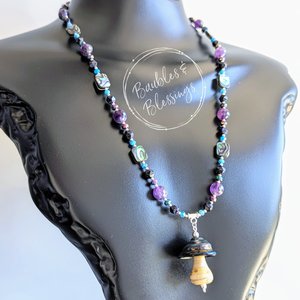 Mushie Spinner Necklace with Galaxy-Inspired Beading
